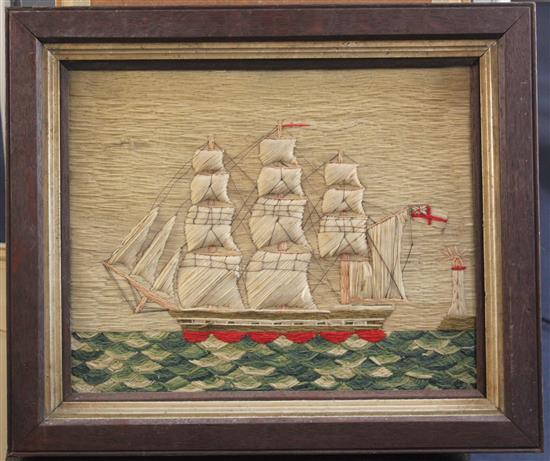 A Victorian woolwork ship picture depicting a frigate and lighthouse, 12.5 x 15.5in.
